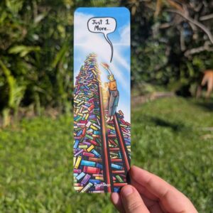 A lady standing on her tippy tows on a lader leaning on a giant pile of books reaching with a book in her had trying to add a book to the top of the pile saying "Just one more..." The pile of books is in all multi coloured and stacks up into the clouds with a sun birst coming from the top.