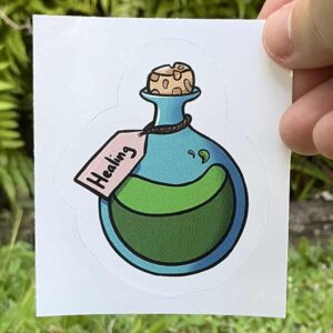 Sticker of a green potion in a round bottal with a cork labled healing.