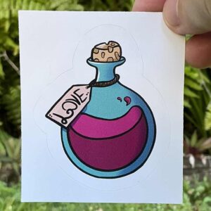 Sticker of a pink potion in a round bottal woth a cork in it labled love.