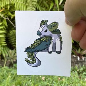 a grean and gray dragon made of rocks and leaves.